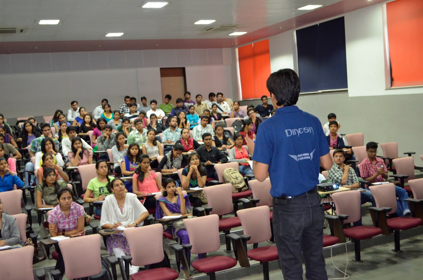 Dinesh Modi speaking to students during a workshop